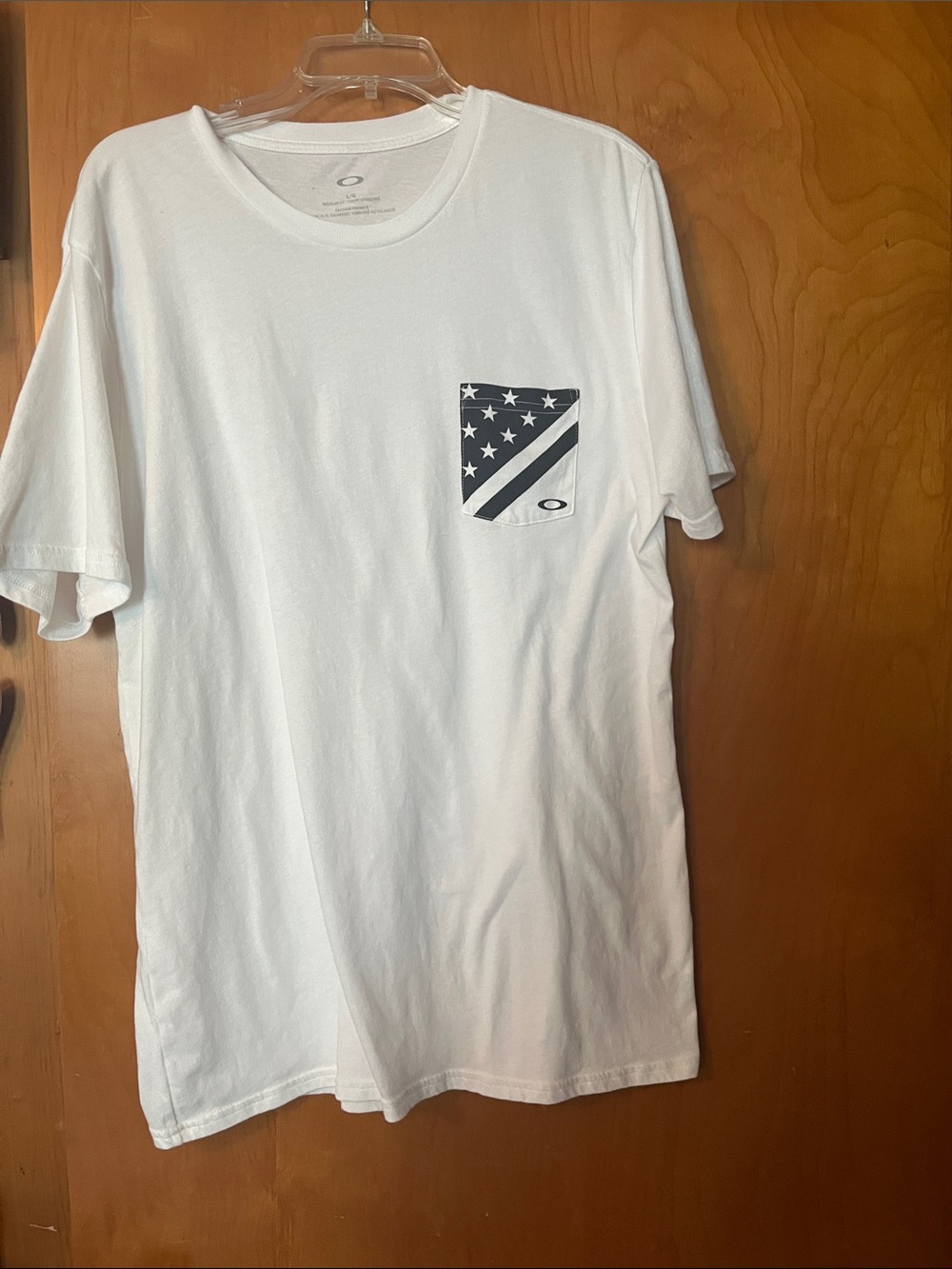 Oakley White Short Sleeve Tee with Navy Pocket Flag Graphic